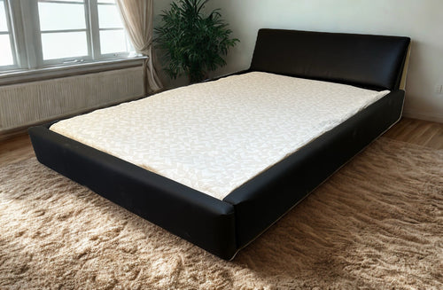 Photo of complete padded hardside waterbed with large angled situp headboard