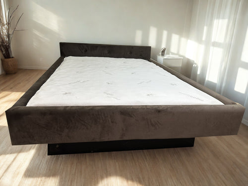 Photo of complete padded hardside waterbed  fabric with  tufted  headboard