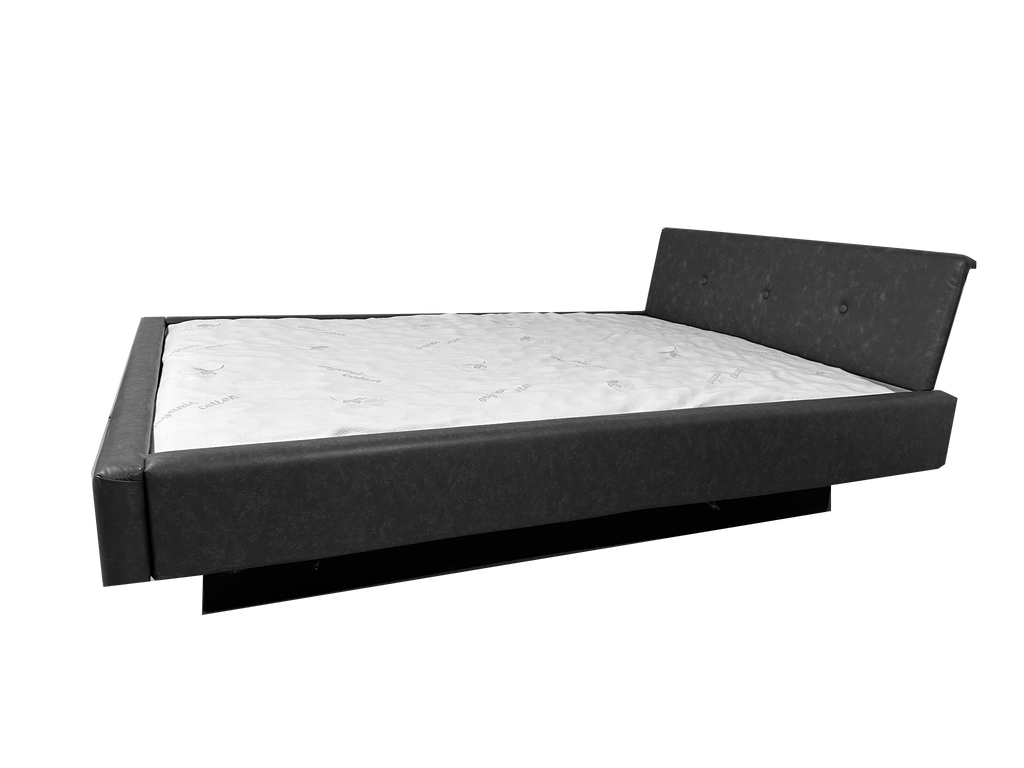 Photo of complete padded hardside waterbed black faux leather with large tufted angled headboard
