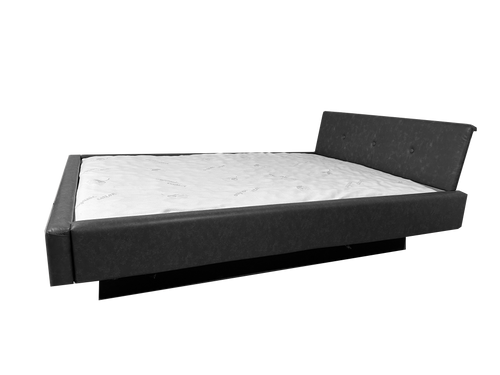 Photo of complete padded hardside waterbed black faux leather with large tufted angled headboard